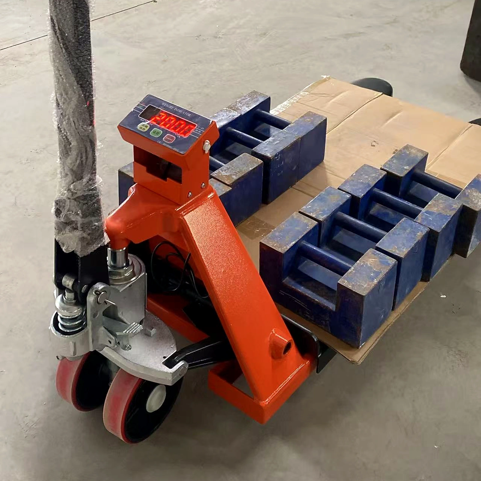 Authentic HENER factory calibration check with visible reference test weights and an illuminated pallet jack scale indicator