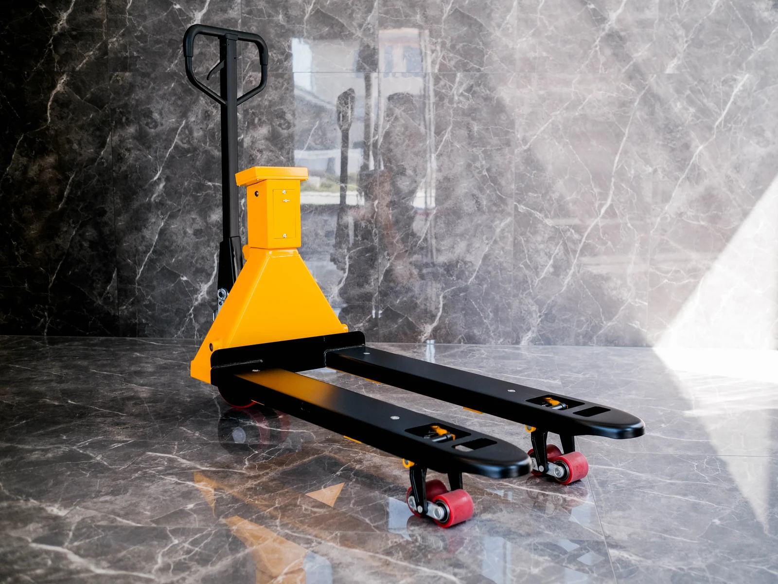 Authentic yellow HENER pallet jack scale with complete outward-facing forks